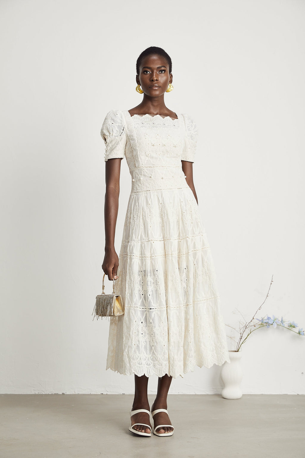 <img src="https://www.beryn-boutique.com/" 
       alt="Elegant White Lace Midi Dress for Work" 
       loading="lazy" />
