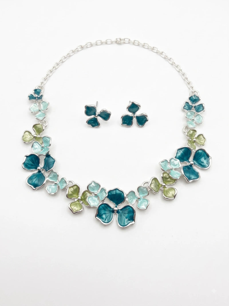 
< img src="https://www.berynea.com/" 
       alt="Teal Enamel Floral Necklace & Earring Set | Botanical Statement Jewelry" 
       loading="lazy" />