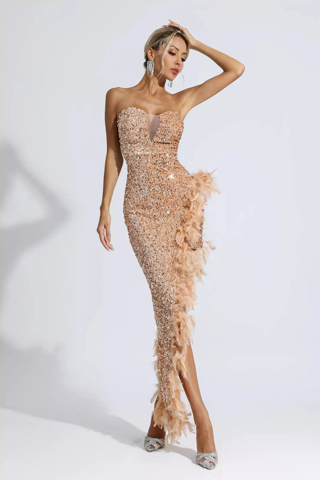 <img src="https://www.beryn-boutique.com/" 
       alt="Backless Sequin Feather Mini Dress" 
       loading="lazy" />