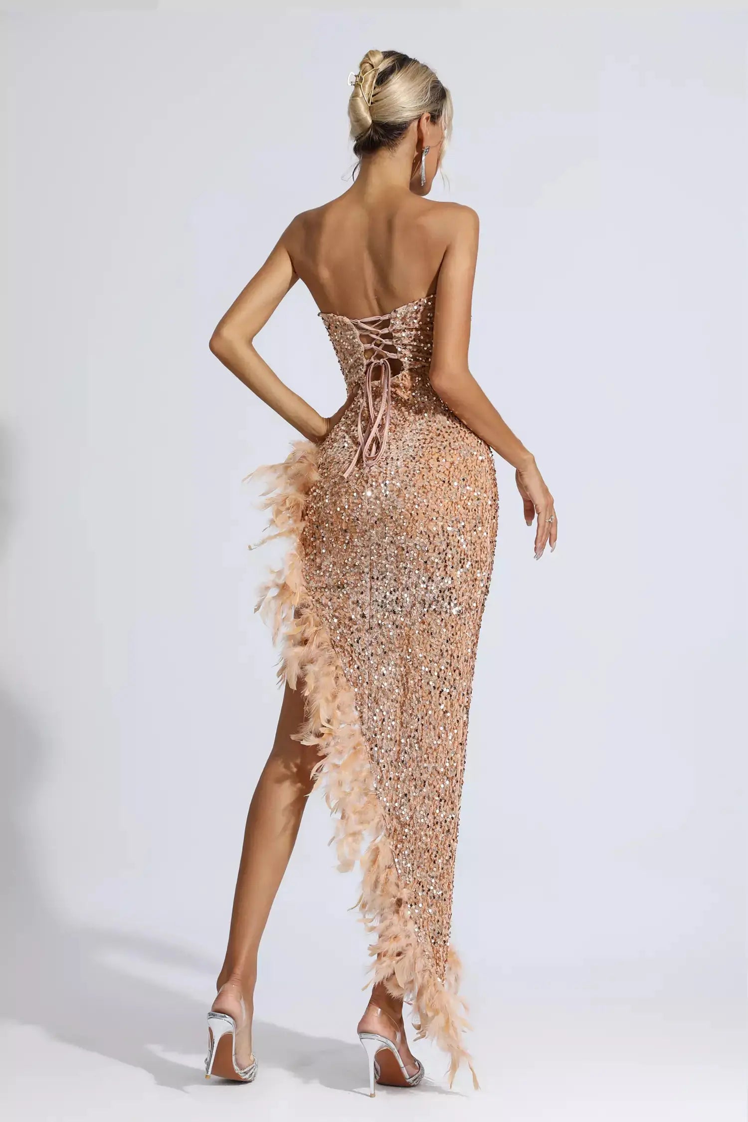 <img src="https://www.beryn-boutique.com/" 
       alt="Backless Sequin Feather Mini Dress" 
       loading="lazy" />