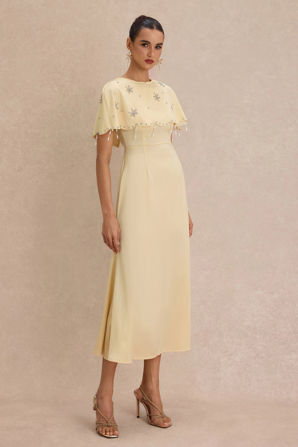 <img src="https://www.beryn-boutique.com/" 
       alt="Yellow Beaded Capelet Dress" 
       loading="lazy" />