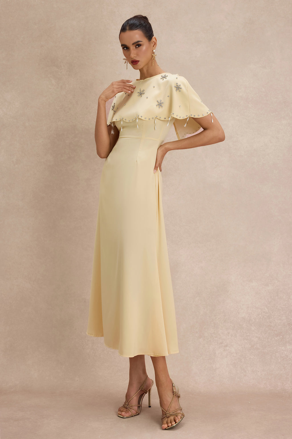 <img src="https://www.beryn-boutique.com/" 
       alt="Yellow Beaded Capelet Dress" 
       loading="lazy" />