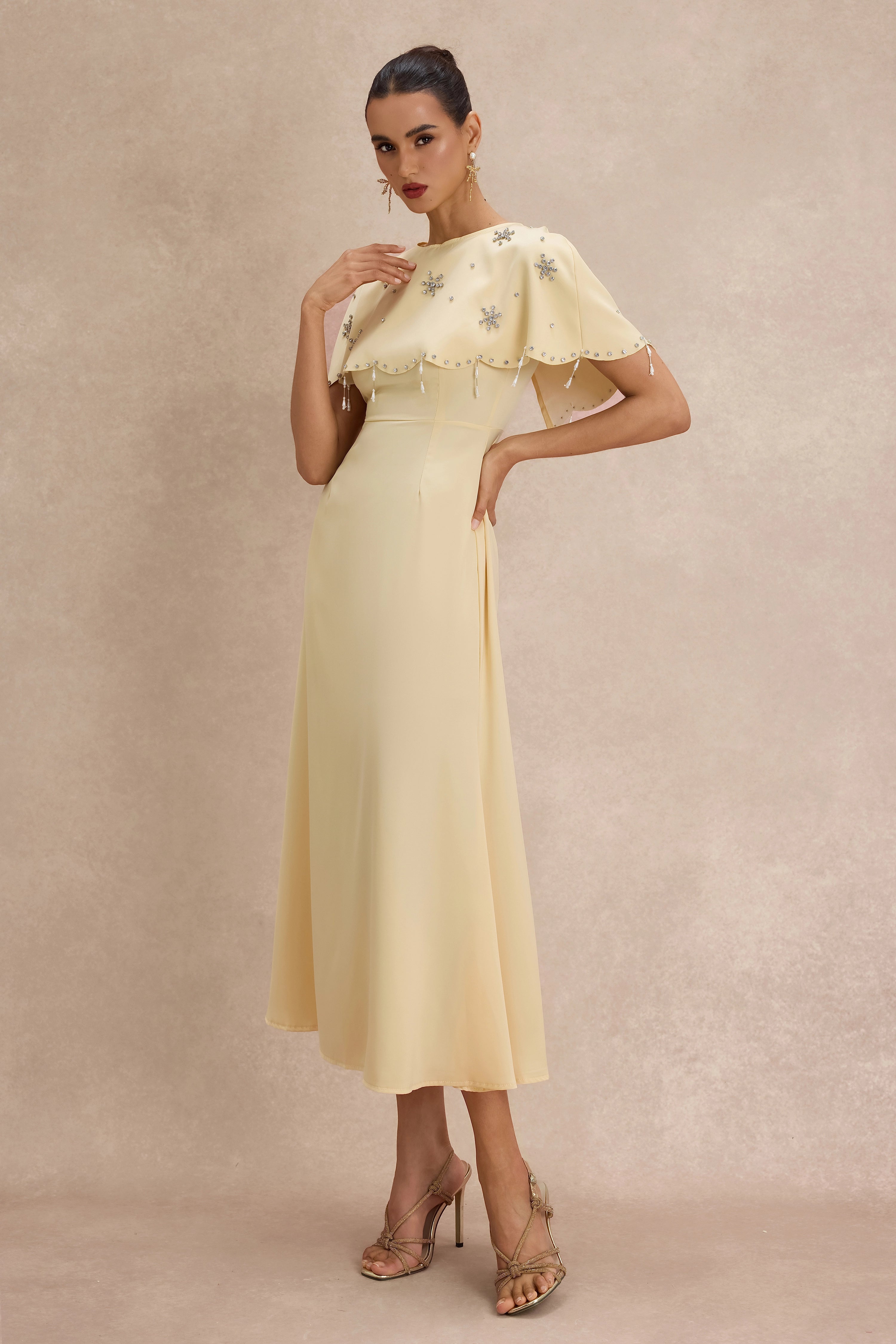 <img src="https://www.beryn-boutique.com/" 
       alt="Yellow Beaded Capelet Dress" 
       loading="lazy" />