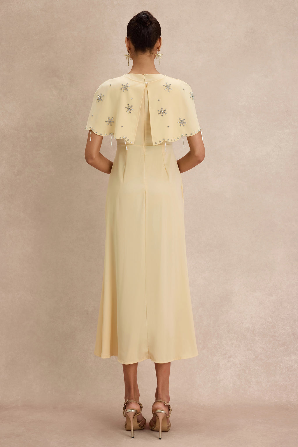 <img src="https://www.beryn-boutique.com/" 
       alt="Yellow Beaded Capelet Dress" 
       loading="lazy" />