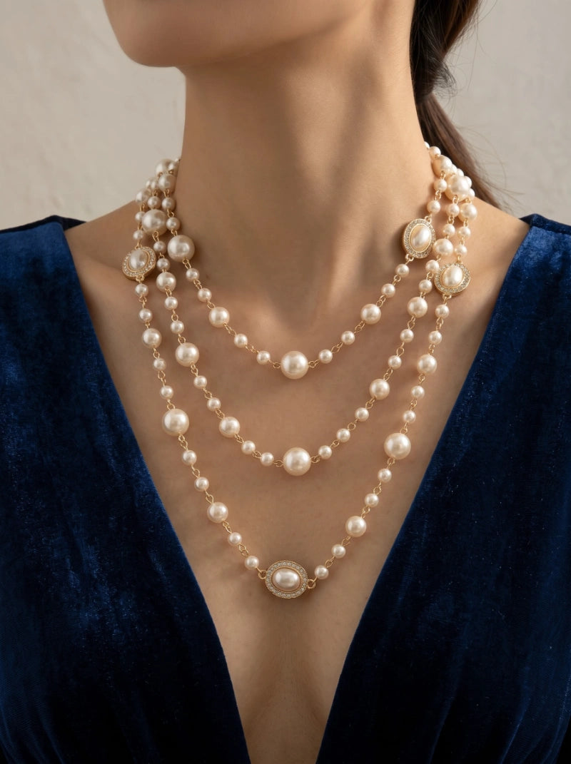 < img src="https://www.berynea.com/" 
       alt="Triple-Layer Pearl Station Necklace | Vintage Gold Layered Jewelry" 
       loading="lazy" />